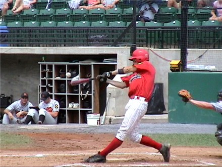 Greg Lynch smashes a home run to left
